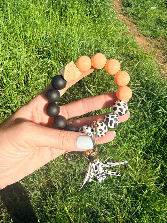Peach and Black Cow Keychain