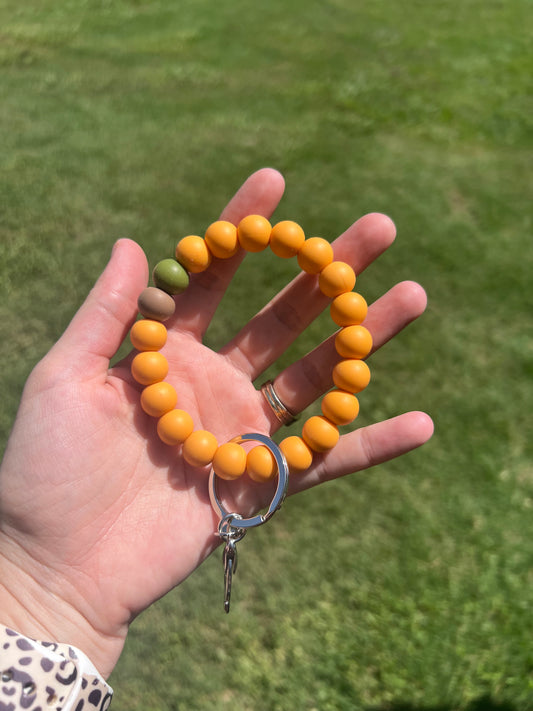 Orange, Green, and Tan Keychains